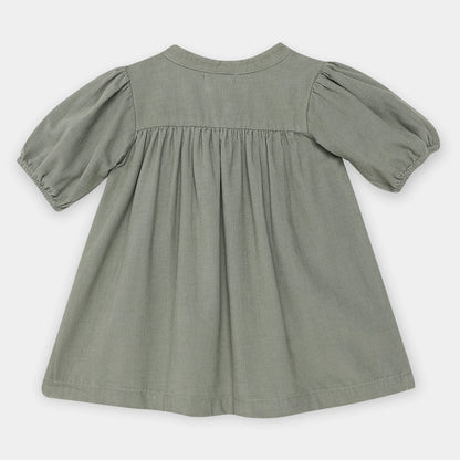Green dress with puff sleeves on a white background