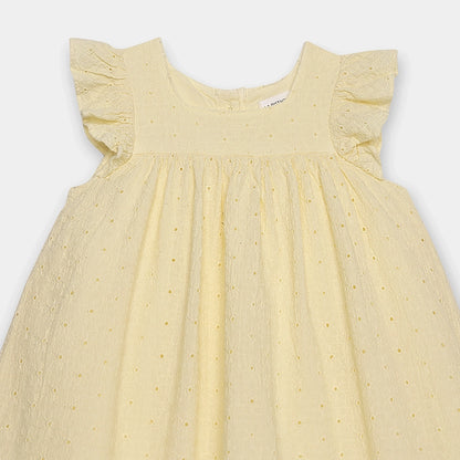 Yellow dress with ruffled sleeves on a light gray background