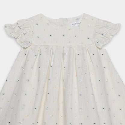 White dress with small patterns on a white background
