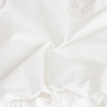 Close-up of white fabric with subtle texture