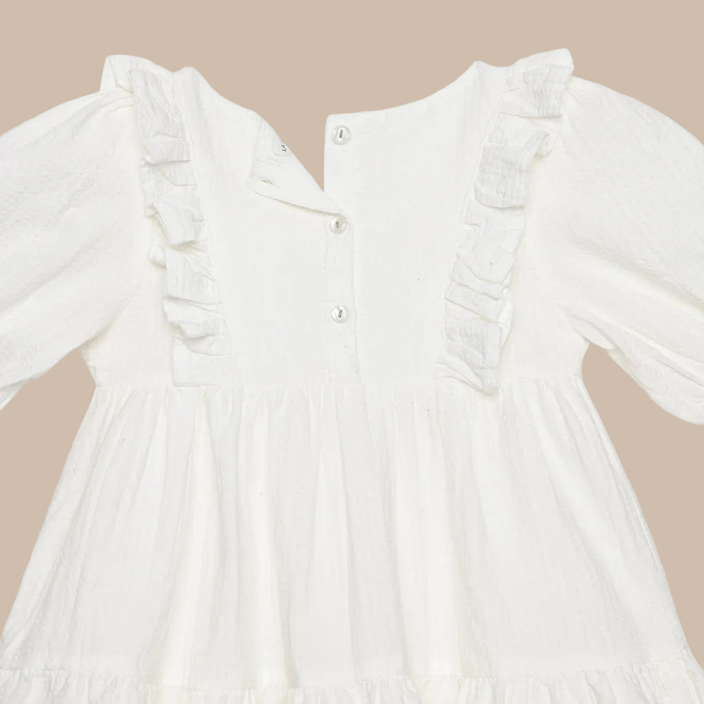 White dress with ruffled sleeves on a white background