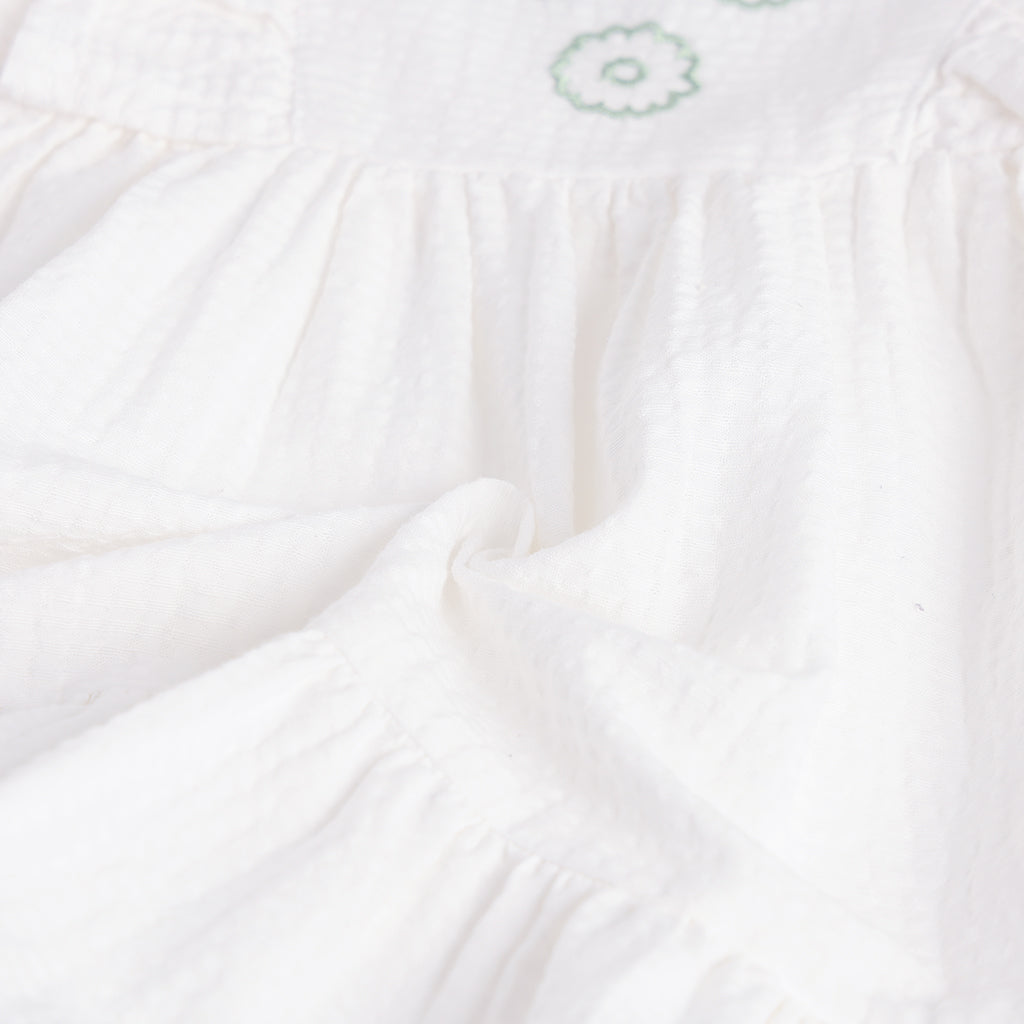 Close-up of white fabric with a subtle pattern