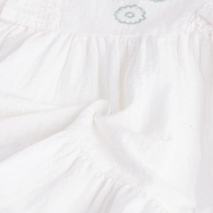 Close-up of white fabric with a subtle pattern