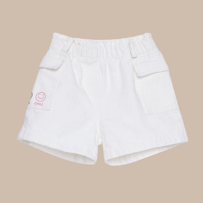 White shorts with a smiley face logo on a white background