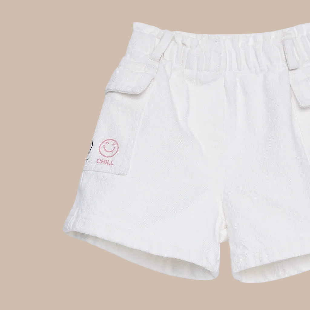 White shorts with a smiley face and 'Chill' text on a white background