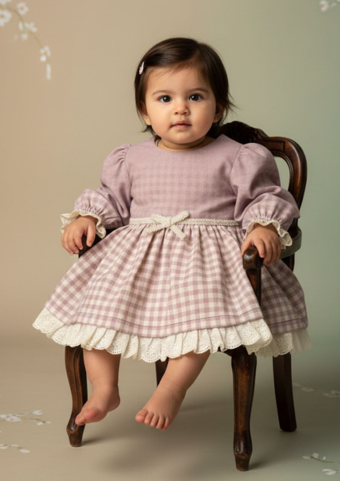 Baby girl sitting on chair wearing lavender royale princess cotton dress with hakoba lace